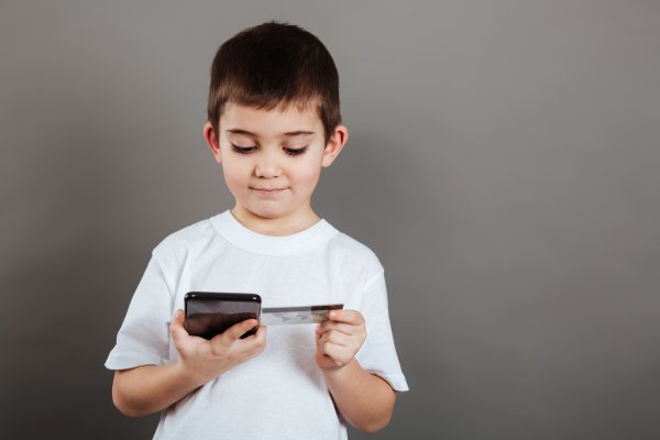 child looking at credit card credit monitoring